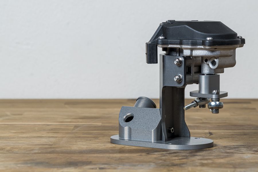 Rennen ITB billet throttle actuator and mounting bracket on a roller-barrel throttle body