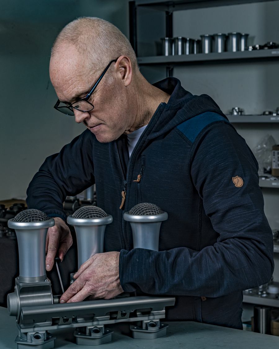 JSR Engineering technician assembling a Rennen ITB throttle body bank on the workshop bench in Denmark