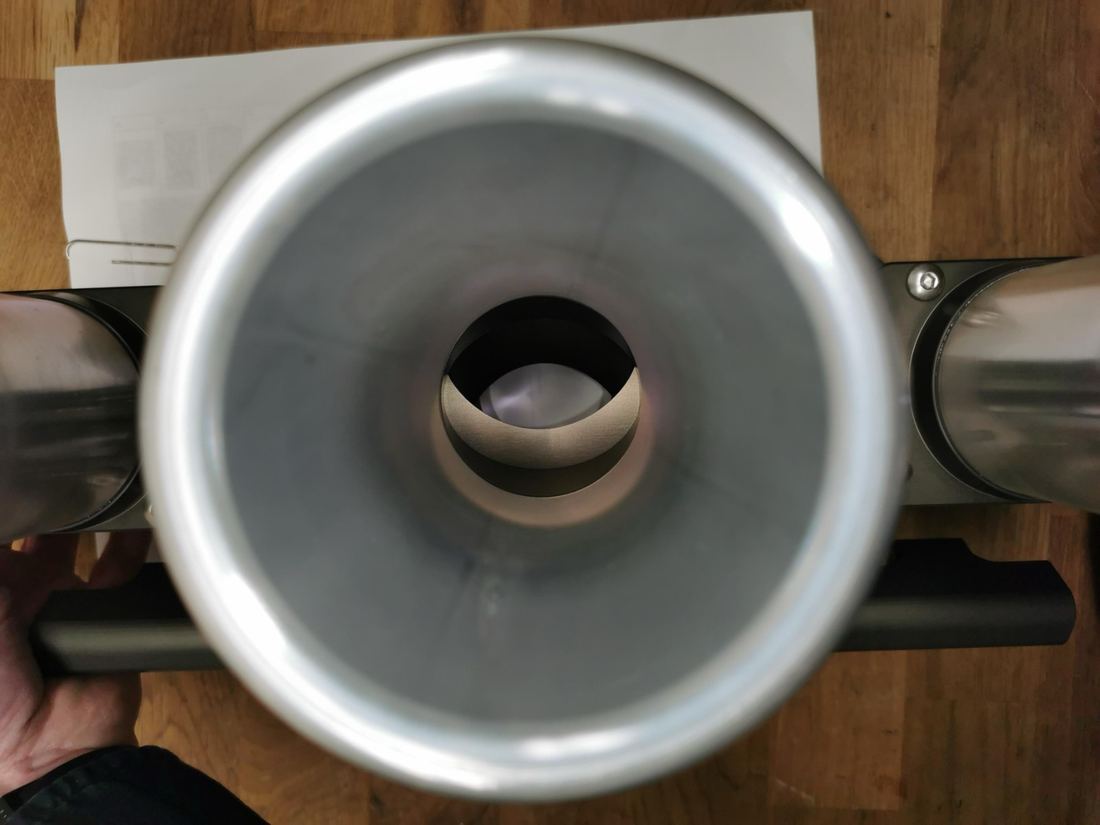 Looking down a Rennen velocity stack into the clear elliptical bore with the roller barrel fully open, nothing obstructing the airflow