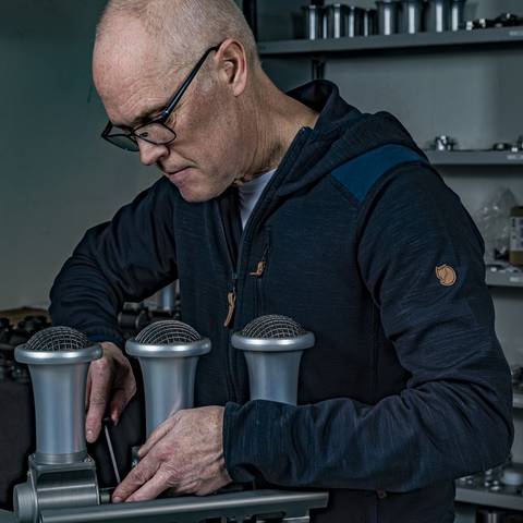 JSR technician assembling a throttle body bank on the bench