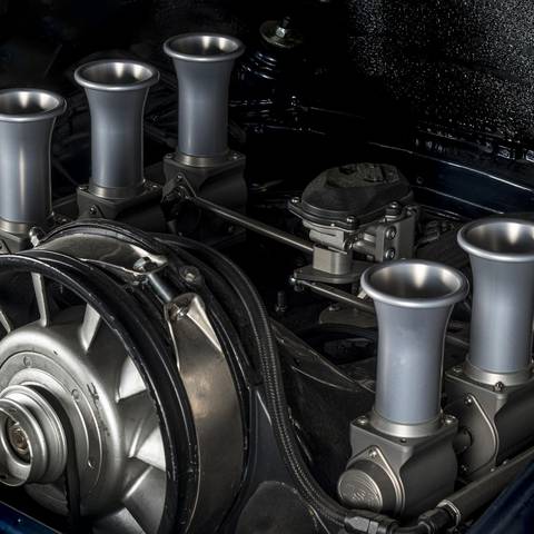 Rennen ITB system with six velocity stacks installed in a Porsche 911 engine bay