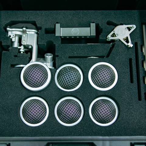 Top-down view of throttle bodies and stacks in custom-cut foam